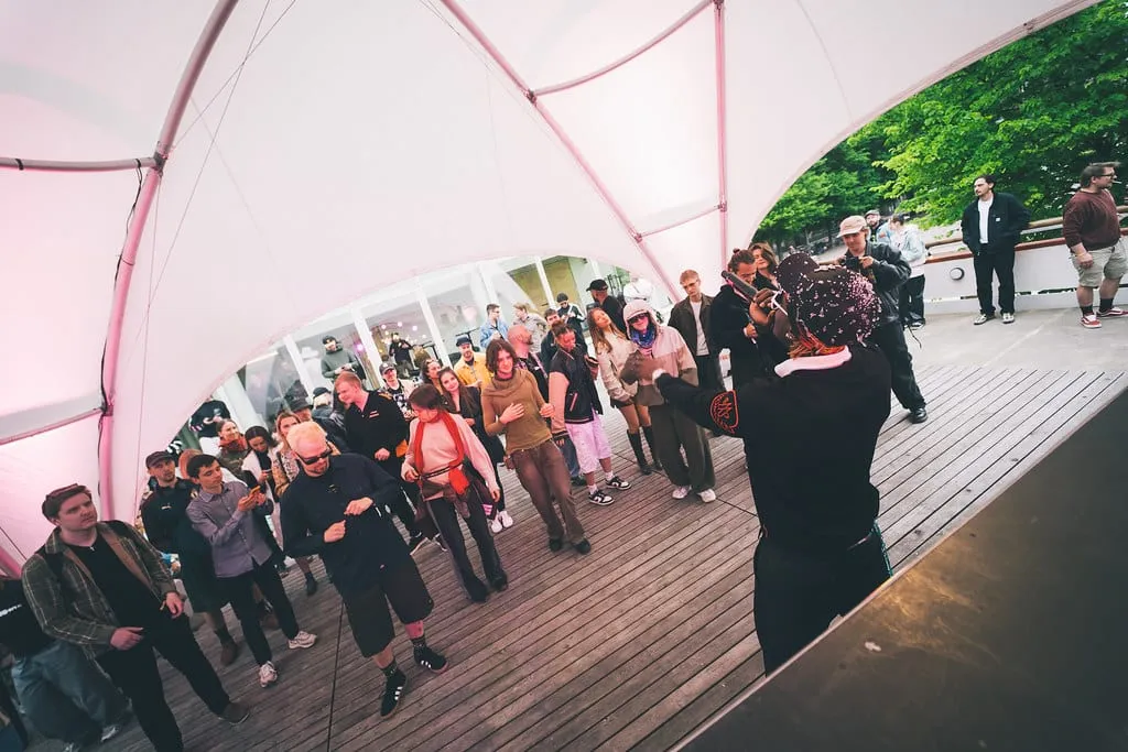 People dancing under the white tent of the Love Stage at ODDfest 2025