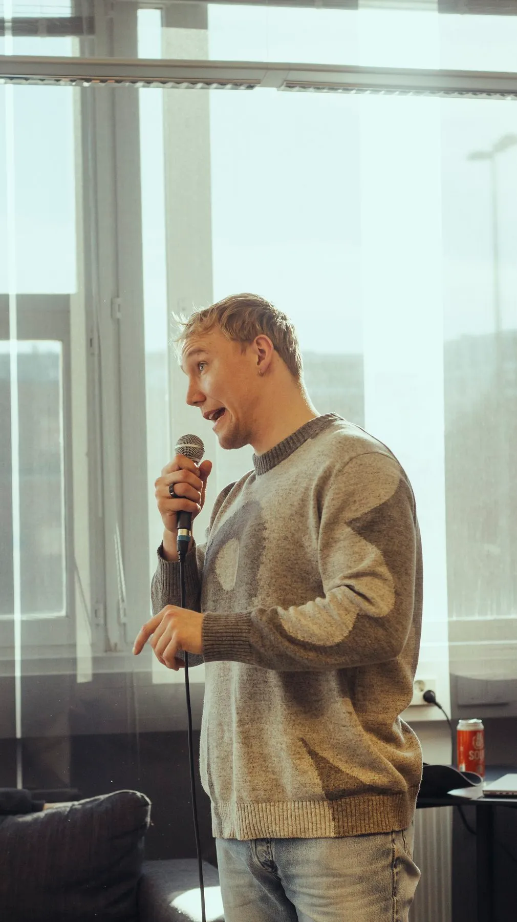 A speaker mid-sentence with a microphone